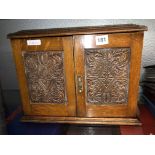 EDWARDIAN OAK CARVED TWO DOOR SMOKERS CABINET 28CM H X 37CM W X 20CM D