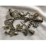SILVER CHARM BRACELET WITH HEART PADLOCK AND NOVELTY CHARMS, INCLUDING LIGHTHOUSE, COMPASS,