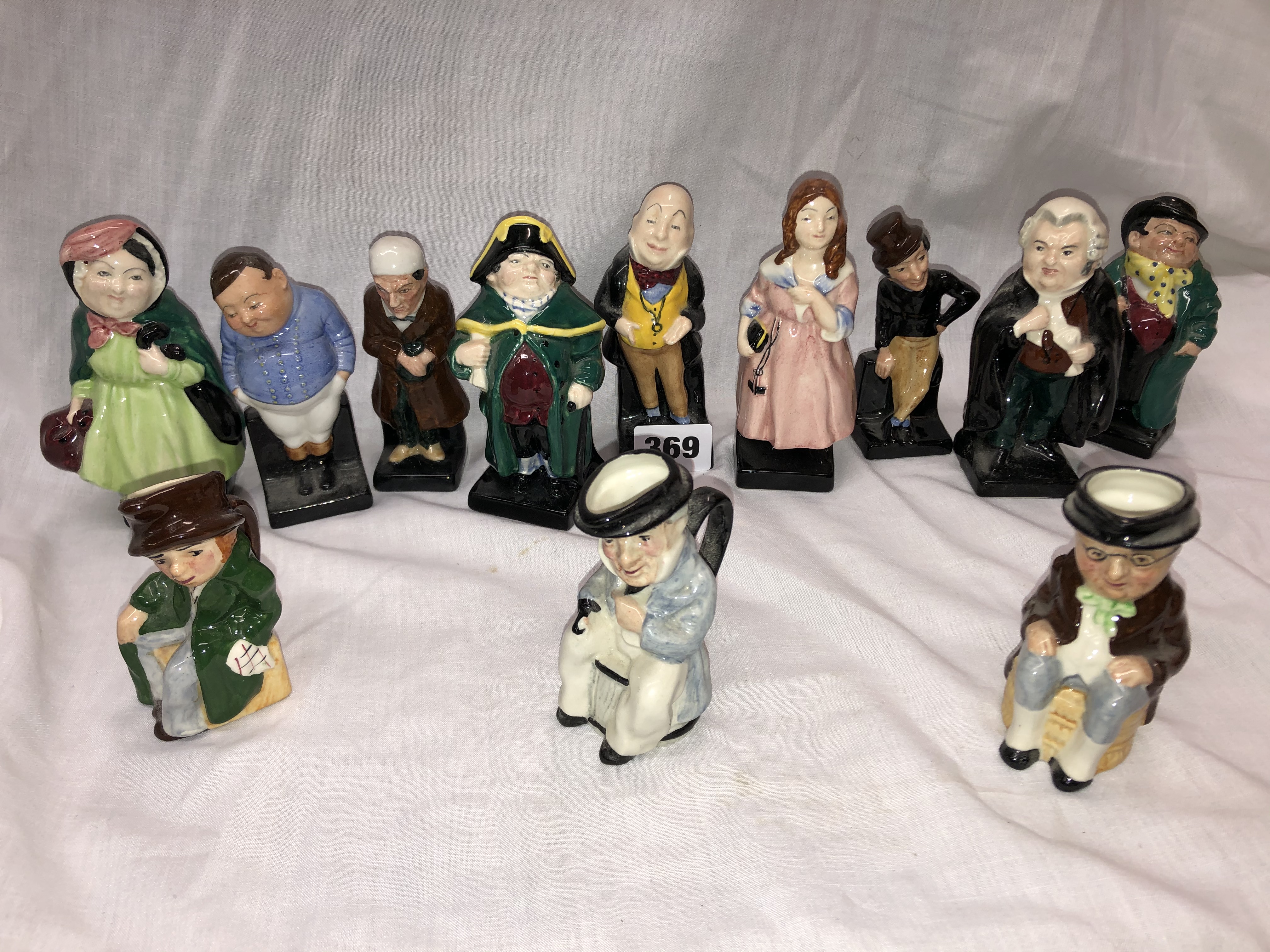 ROYAL DOULTON DICKENSIAN FIGURE SERIES (9) AND THREE ARTONE DICKENS CHARACTER JUGS