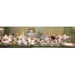 SHELF OF BONE CHINA MINIATURE CERAMIC TEACUPS, SAUCERS,