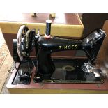 CASED SEWING MACHINE