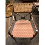 REGENCY MAHOGANY BERGERE CANED AND SPINDLE CROSS STRETCHER BACKED ELBOW CHAIR WITH CANED SEAT AND