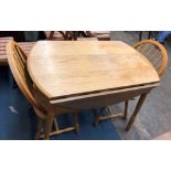 LIGHT WOOD DROP FLAP TABLE AND FOUR HOOP BACK KITCHEN CHAIRS 75CM H X 61CM (UNOPENED)/ 105CM