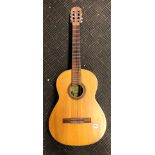 CASED ACOUSTIC GUITAR