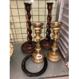 PAIR OF WOODEN BARLEY TWIST CANDLESTICKS AND A PAIR OF BRASS CANDLESTICKS