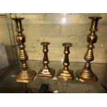 TWO PAIRS OF BRASS CANDLESTICKS