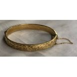 9CT METAL CORE ENGRAVED BANGLE WITH SAFETY CHAIN 10.