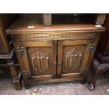 OAK LINEN FOLD CARVED CUPBOARD CONTAINING VINTAGE 78 RECORDS