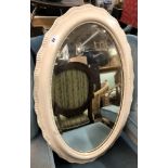 WHITE PAINTED SERPENTINE EDGED OVAL MIRROR,