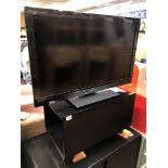 PANASONIC VIERA 32INCH TV ON A BLACK MOBILE STAND WITH REMOTE CONTROL