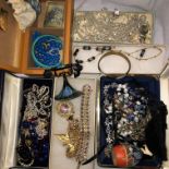 SEVERAL BOXES OF ASSORTED COSTUME JEWELLERY INCLUDING GLASS BEAD NECKLACES, BROOCHES , BANGLES,