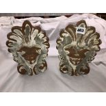 PAIR OF ARCHITECTURAL TERRACOTTA FACEMASK RIDGE ENDS
