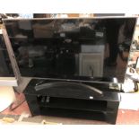 LG TV ON BLACK MEDIA STAND