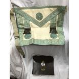 LEATHER POUCH CONTAINING A MASONIC APRON, MOZART LODGE, ALONG WITH SOME EPHEMERA INCLUDING CARDS,