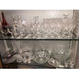 TWO SHELVES OF CUT GLASS DRINKING GLASSES, DECANTERS AND STOPPERS, BARREL,