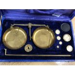 CASED SET OF BRASS BALANCE SCALES AND WEIGHTS