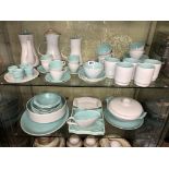 TWO SHELVES OF POOLE POTTERY GREY AND TURQUOISE TWO TONE DINNERWARES,