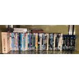 SHELF OF VARIOUS DVDS AND SOME PLAYSTATION 2 GAMES