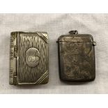 19TH CENTURY SILVER VESTA CASE AND A PLATED STAMP HOLDER IN THE FORM OF A BOOK