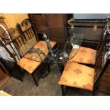 SCROLLED WROUGHT IRON BASED OVAL DINING TABLE AND FOUR UPHOLSTERED DINING CHAIRS