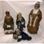 FOUR STONEWARE GLAZED CHINESE IMMORTAL FIGURES