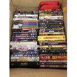 ASSORTED JIGSAW PUZZLES AND A BOX OF DVDS INCLUDING FEATURE FILMS AND COMEDY SERIES