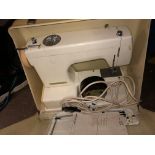 CASED SEWING MACHINE