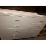 WHITE FIVE DRAWER CHEST AND A MATCHING SMALLER FIVE DRAWER CHEST