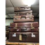 STACK OF VINTAGE SUITCASES AND DEMOB TYPE CASES