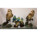 RESIN MOULDED FIGURES OF OWLS AND THREE BLUE TITS