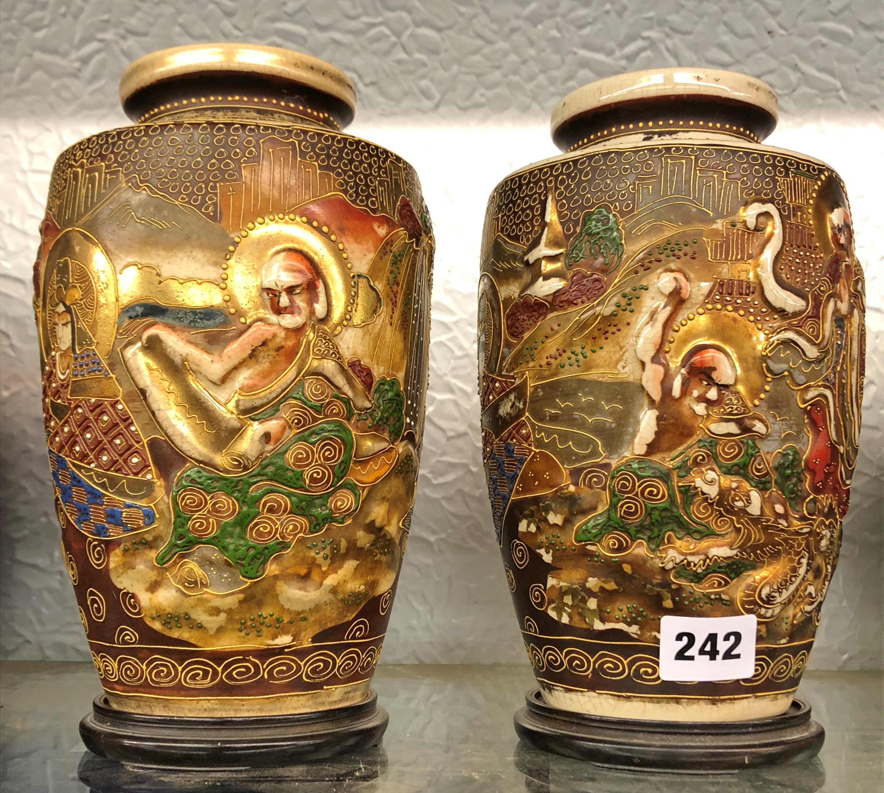 PAIR OF JAPANESE SATSUMA EARTHENWARE VASES ON STANDS 23.