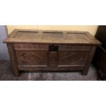 18TH CENTURY OAK CARVED COFFER WITH HINGED THREE PANEL TOP ENCLOSING AN INTERNAL BOX