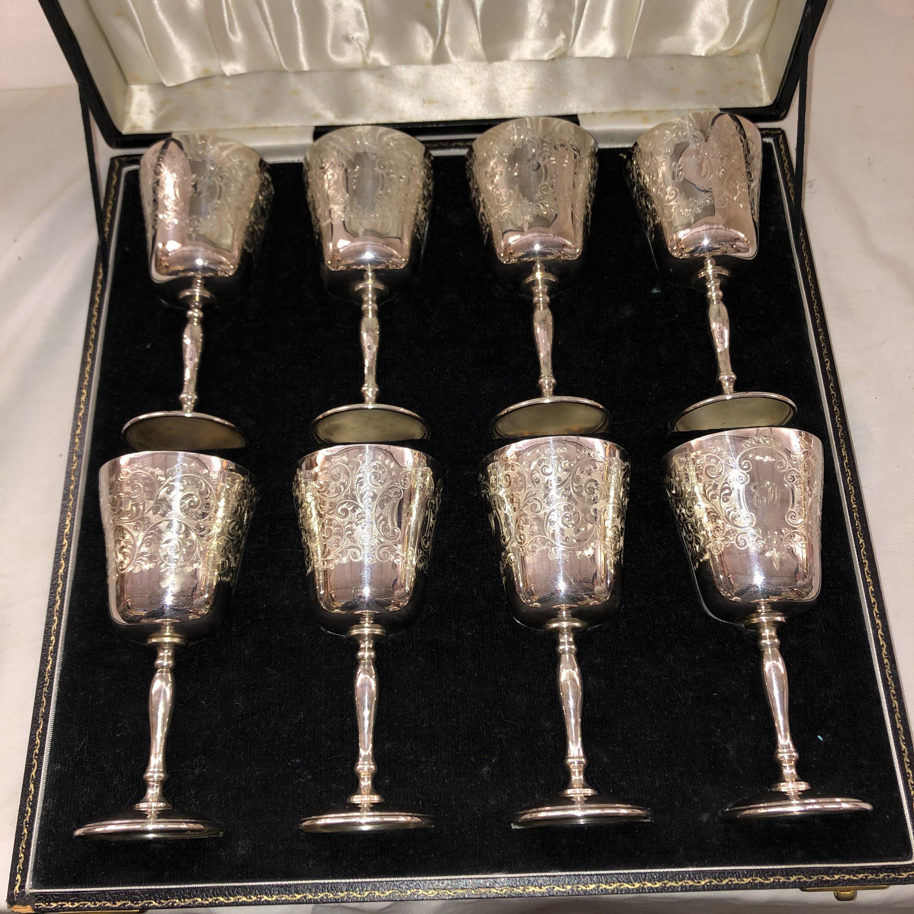 CASED SET OF EIGHT SILVER GILT ENGRAVED GOBLETS,