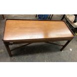 MAHOGANY CHIPPENDALE INFLUENCED RECTANGULAR COFFEE TABLE WITH FRET CARVED CROSS STRETCHER