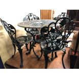 GREEN PAINTED CAST IRON VICTORIAN STYLE PATIO TABLE AND FOUR CHAIRS