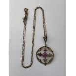 9CT GOLD AMETHYST AND SEED PEARL DISC PENDANT ON A FINE TRACE CHAIN (ONE SEED PEARL DISPLACED AND
