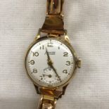 LADIES 9CT GOLD CASED ACCURIST JEWELLED WRISTWATCH ON A ROLLED GOLD ROSE COLOURED EXPANDING STRAP