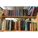 TWO SHELVES OF BOOKS READERS DIGEST,