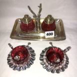 PLATED STAGS HEAD INK STAND DISH WITH CRANBERRY INKWELLS AND A PAIR OF CRANBERRY TABLE SALTS AND