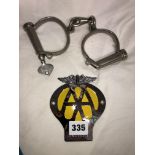 VINTAGE AA GRILLE BADGE AND PAIR OF HANDCUFFS