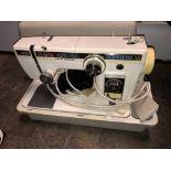 CASED NEW HOME ELECTRIC SEWING MACHINE