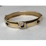 9CT GOLD CZ AND OBSIDIAN BANGLE WITH SAFETY CLASP 12.