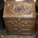 HEAVILY CARVED JACOBEAN REVIVAL OAK BUREAU (DIMENSIONS-W.89CM,H.110CM,D.