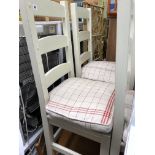 SET OF FOUR CREAM PAINTED LADDER BACK CHAIRS WITH TIE-ON CHEQUERED CUSHIONS