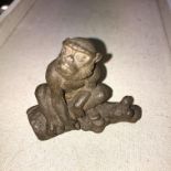 BRONZE SEATED MONKEY ON A BRANCH