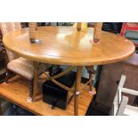 LIGHT PINE CIRCULAR DINING TABLE WITH BENTWOOD CROSSOVER STRETCHER LEGS