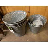 FIVE RIBBED GALVANIZED PLANTERS AND TWO SMALLER PLANTERS