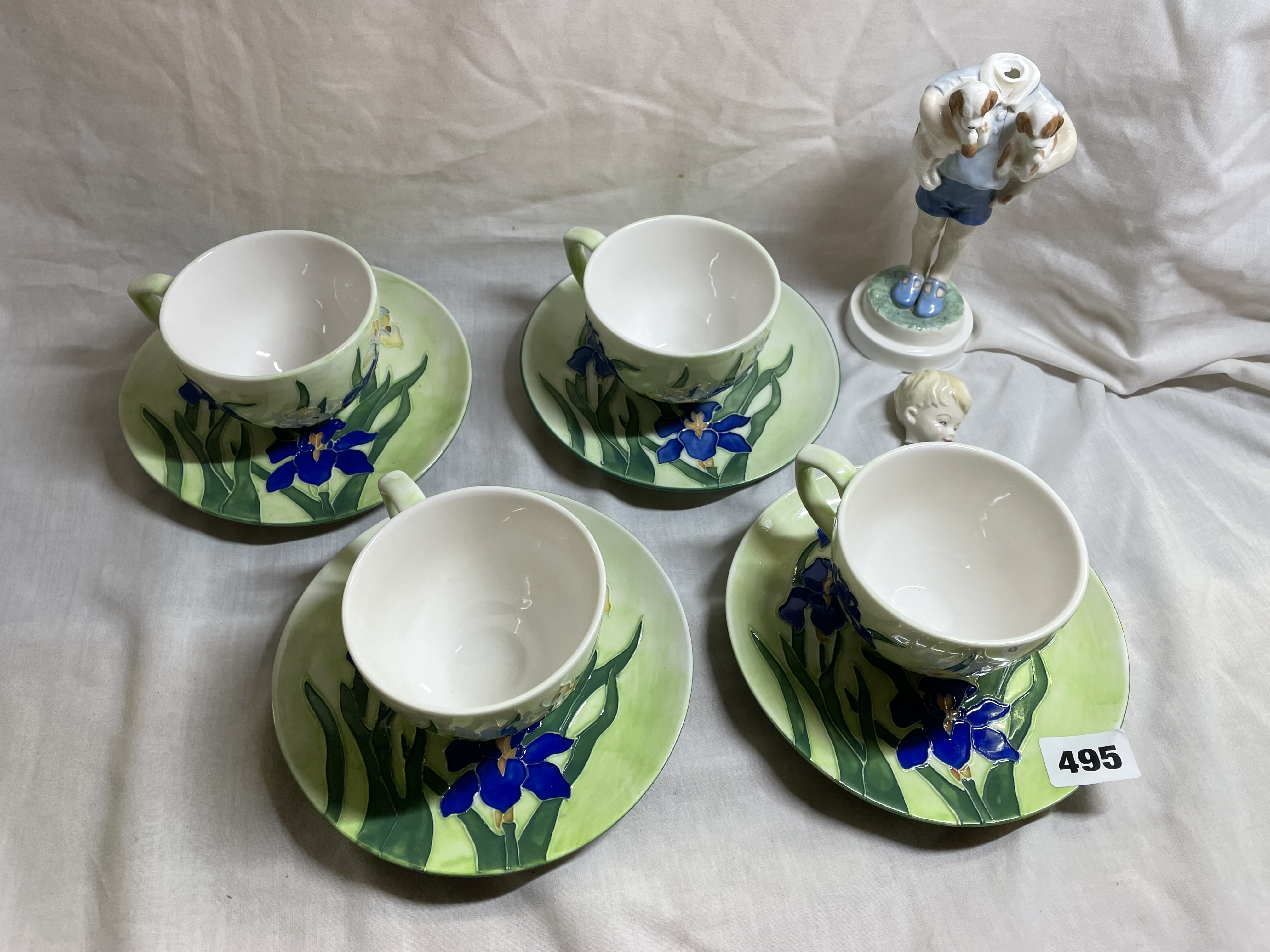 FOUR MOORCROFT INSPIRED TEACUPS AND SAUCERS AND A ROYAL WORCESTER FIGURE A/F