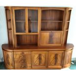 1970S TEAK GLAZED LOUNGE UNIT WITH QUADRANT END SECTIONS