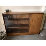 1960S TEAK DWARF CABINET WITH GLAZED SLIDING DOORS